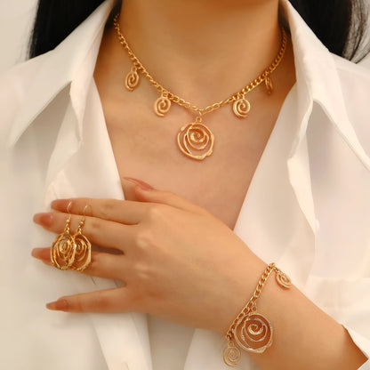 Gold spiral donut alloy jewellery set showing adjustable necklace, matching bracelet, and ear hooks on a plain background.