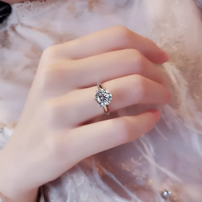 White gold plated zircon ring with six-claw setting and geometric shape on white copper base