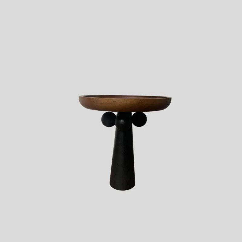 Round beech wood tray with high legs for candles and aromatherapy accessories on wooden table