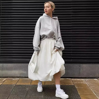 Women's long solid-colour cotton skirt shown in black and white.