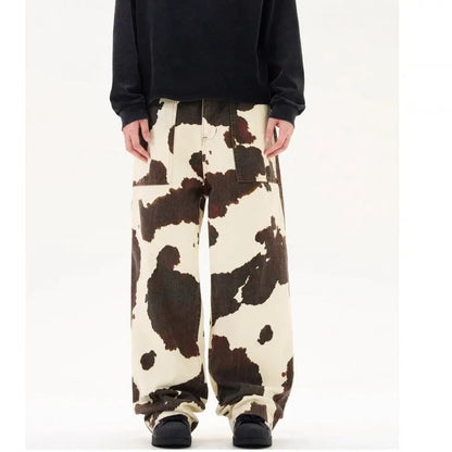 Men's straight-leg casual trousers with a retro-style cows pattern print in a brown colour.
