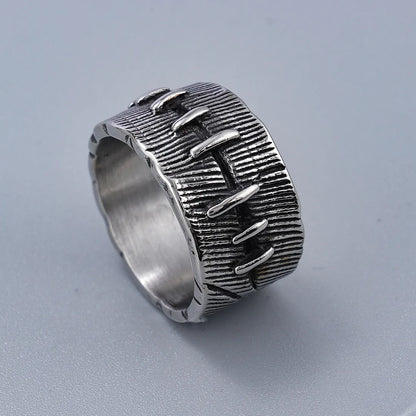 Dark geometric titanium steel punk ring showing U-shape and double ring design with stitched texture.