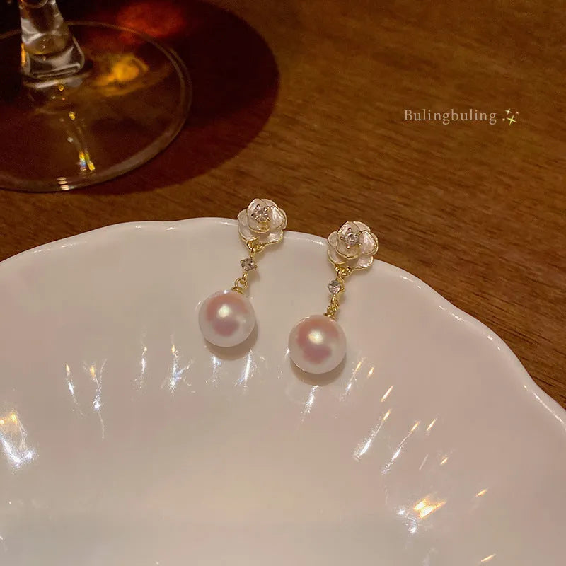Camellia flower stud earrings for women in alloy with floral design