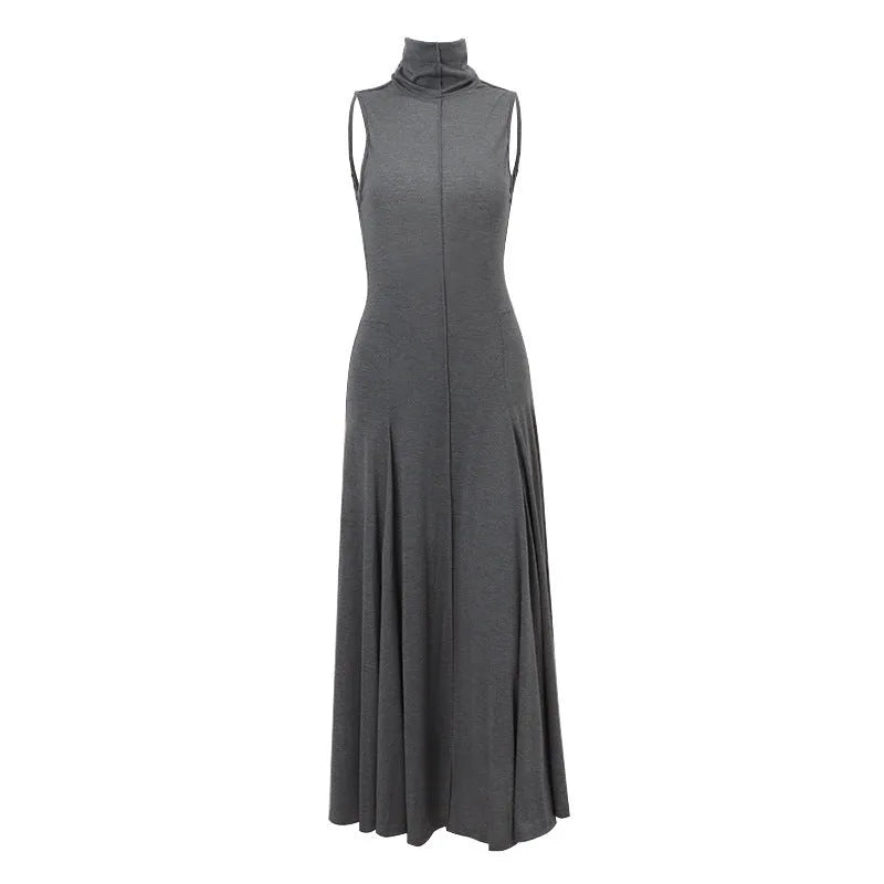 Grey slim-fit cotton dress with a half turtleneck and backless design on a mannequin.