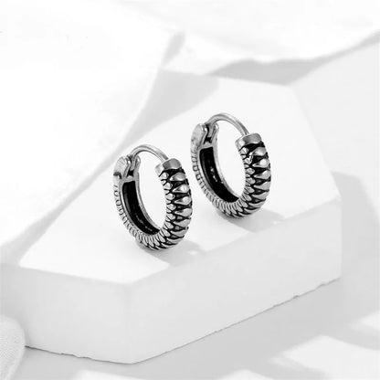 Silver retro twist earrings with geometric stripe design and round elements on stainless steel