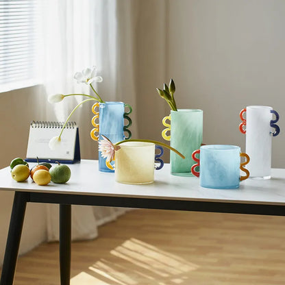 Handmade straight glass vase with a gradient colour effect and polished surface in a Nordic modern style.