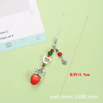 Plastic and resin fruit charm keychain with apple, strawberry designs on silver rope