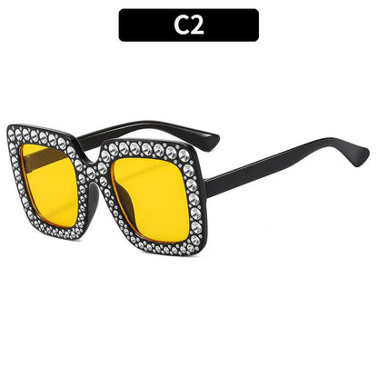 Plastic sunglasses with fashion personality styling in various colour options including black frame and transparent tea frame