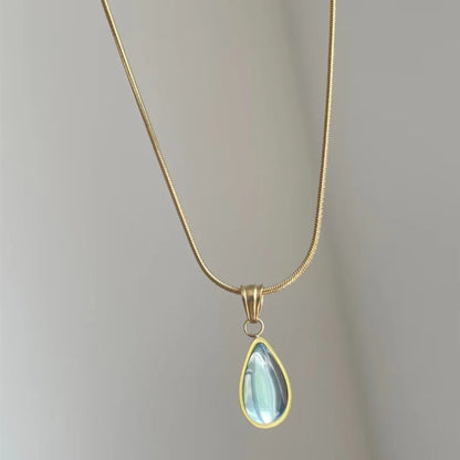 Retro blue and green water drop necklace with gem inlay on a silver titanium steel snake chain.