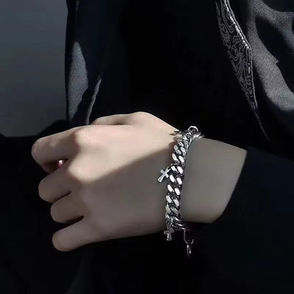Men's titanium steel bracelet with a geometric cross design on a wrist.