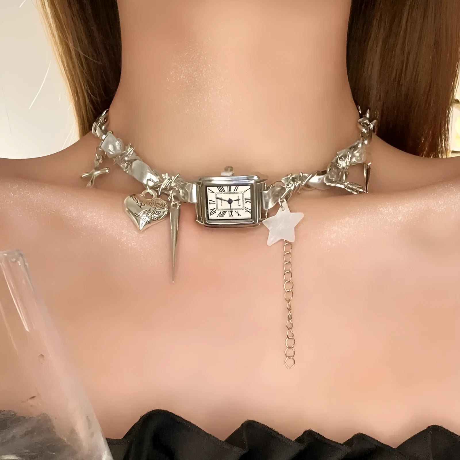 Dark women's layered necklace with twin chains, a cross pendant, and textured hemp-style links.