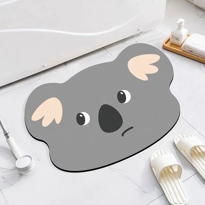 Alien-shaped diatomaceous earth bathroom mat with a cartoon hippo design on a tiled floor.