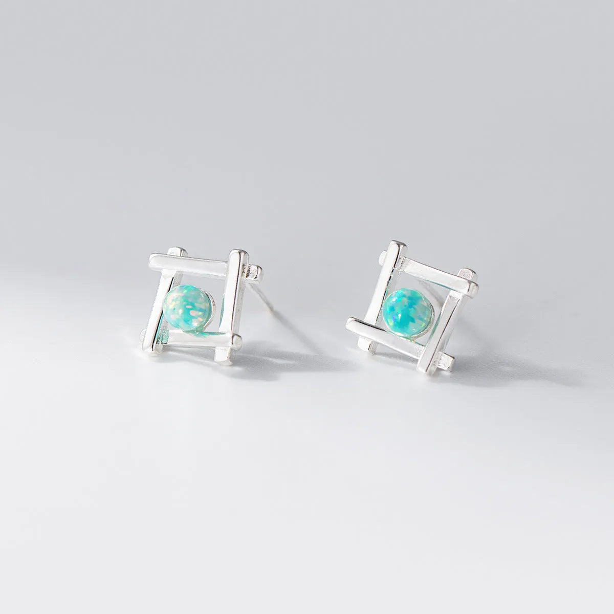 Women's geometric cross quadrangle stud earrings in sterling silver with gold or silver plating options