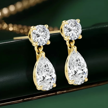 925 sterling silver water drop moissanite stud earrings with two round stones in gold or silver finish.