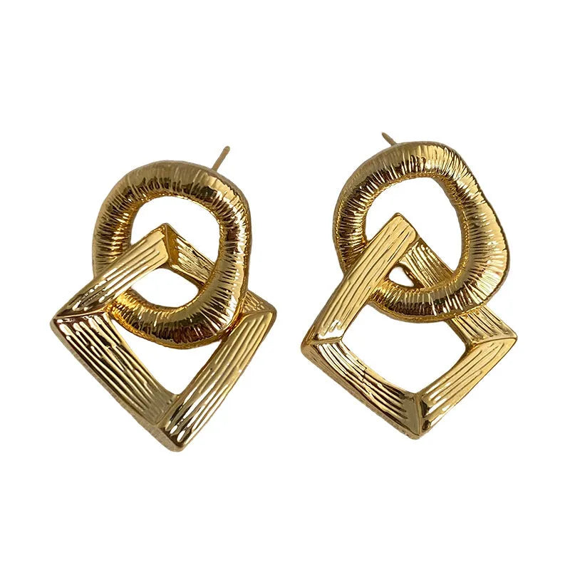 Copper geometry circle pendant earrings with electroplated gold finish measuring 3.4cm in height
