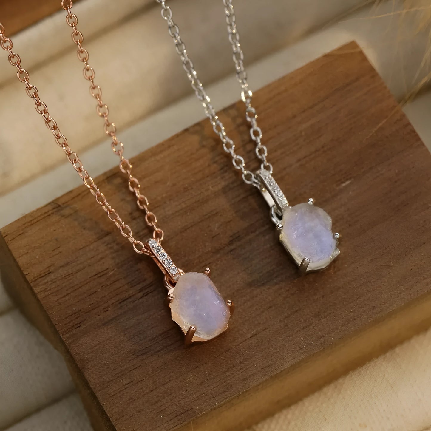 Geometric crystal moonstone pendant on an adjustable sterling silver necklace chain.