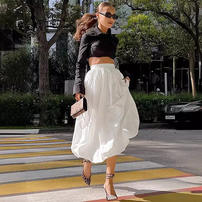 Women's long solid-colour cotton skirt shown in black and white.