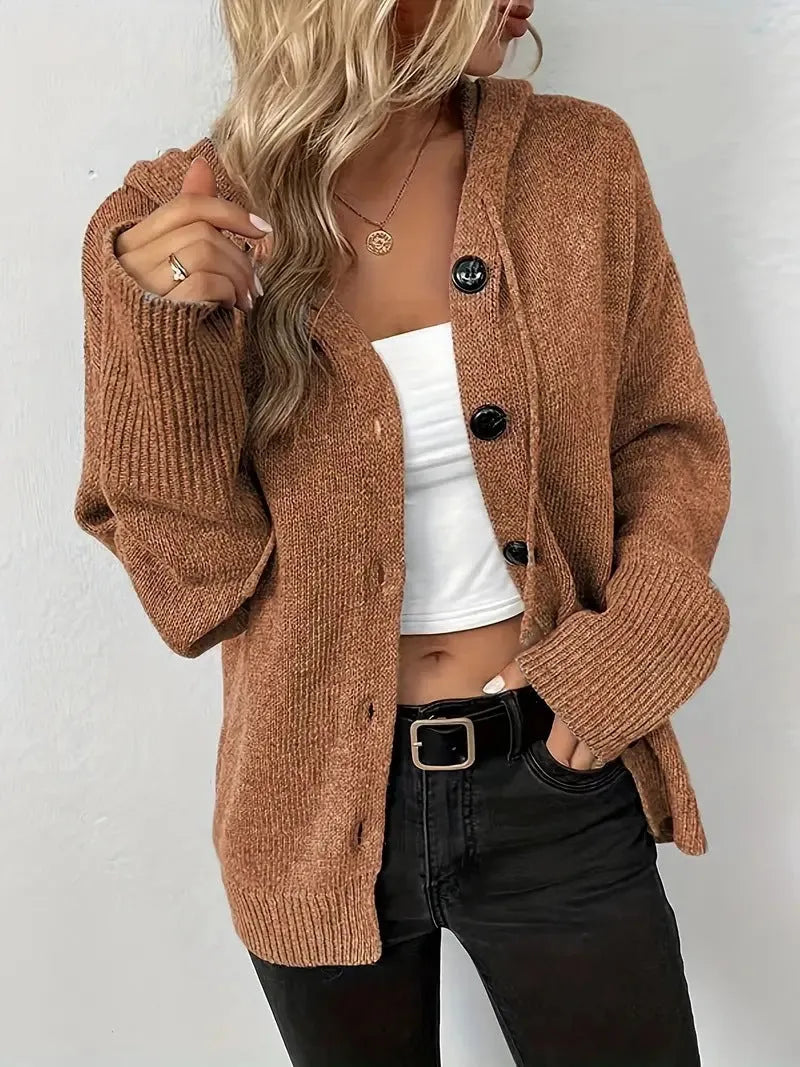 Loose fit grey hooded cardigan sweater with long sleeves on a hanger.