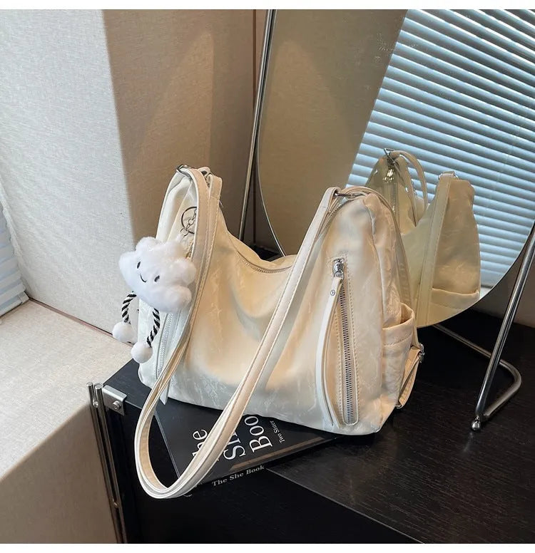 Women's soft PU backpack shoulder bag with pendant accessory in multiple colour options