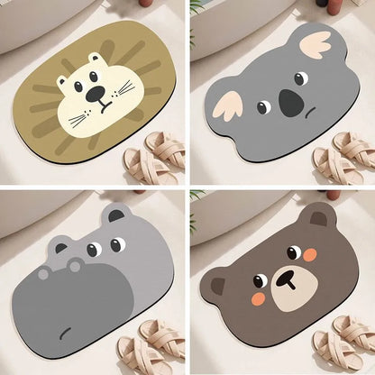 Alien-shaped diatomaceous earth bathroom mat with a cartoon hippo design on a tiled floor.