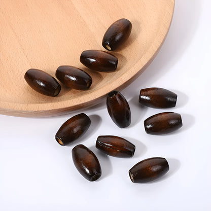 Dark coffee coloured oval wooden bead with M-shaped profile and baked varnish finish