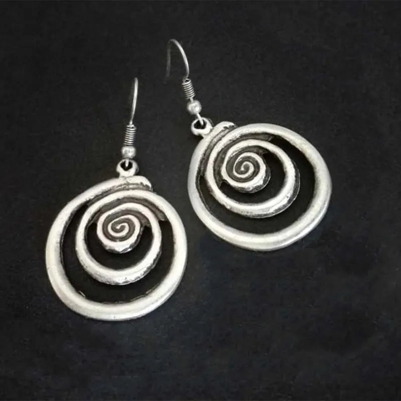 Geometric spiral earrings with a retro distressed silver finish, measuring 2.6cm wide by 5cm long for a unisex national style aesthetic.