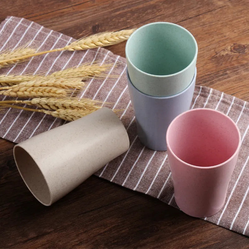 A cylindrical wheat straw plastic bathroom cup in a Nordic colour, holding toothbrushes.