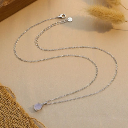 Geometric crystal moonstone pendant on an adjustable sterling silver necklace chain.