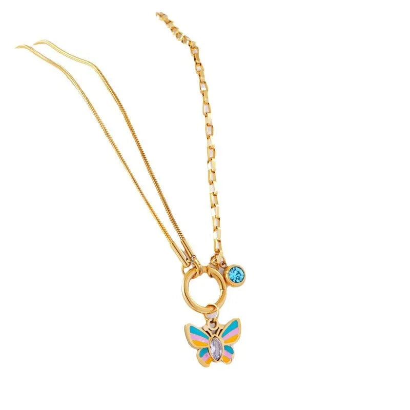 Gold-coloured titanium steel butterfly necklace and matching bracelet set on a snake bone chain.