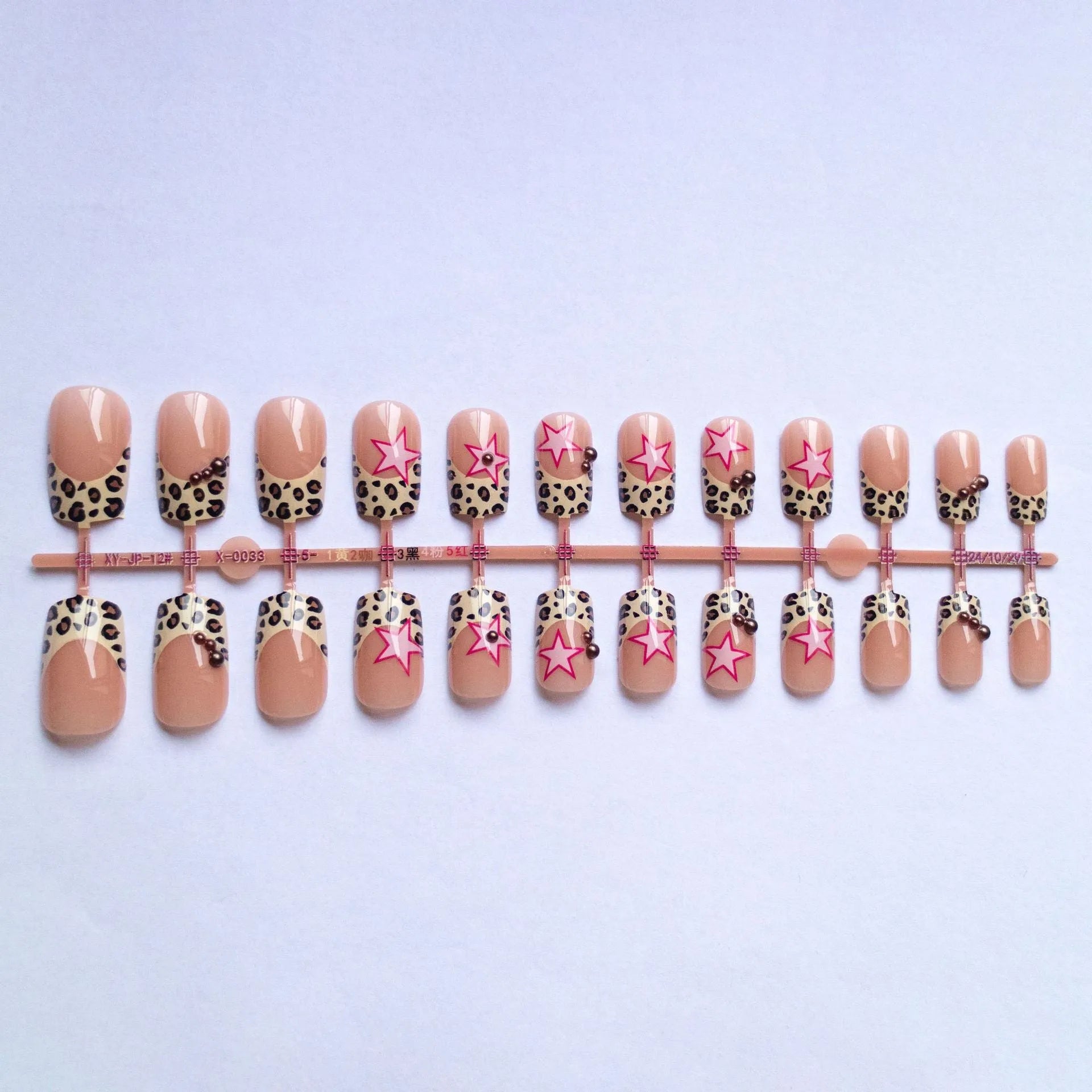 Leopard print French false nails with five-pointed star and pearl diamond accessories in retro European style