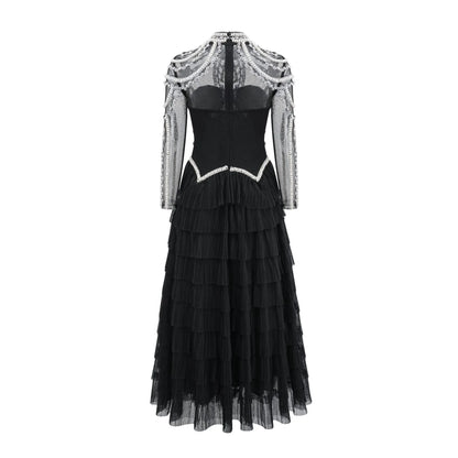 Black long sleeve beaded dress for women with 3D decoration and mid-waist fit.