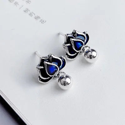 Blue lotus earrings with retro artistic seedpod tassel design, 1.2cm wide alloy studs
