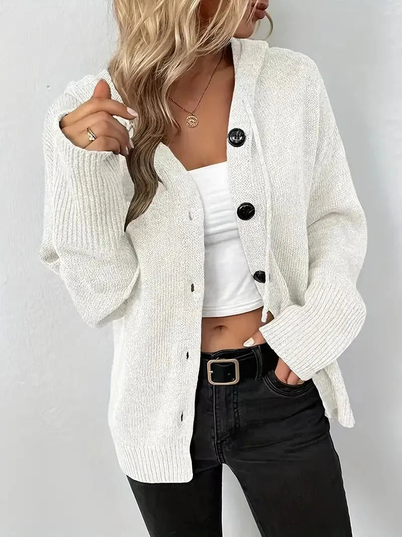 Loose fit grey hooded cardigan sweater with long sleeves on a hanger.