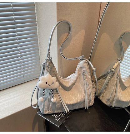 Women's soft PU backpack shoulder bag with pendant accessory in multiple colour options