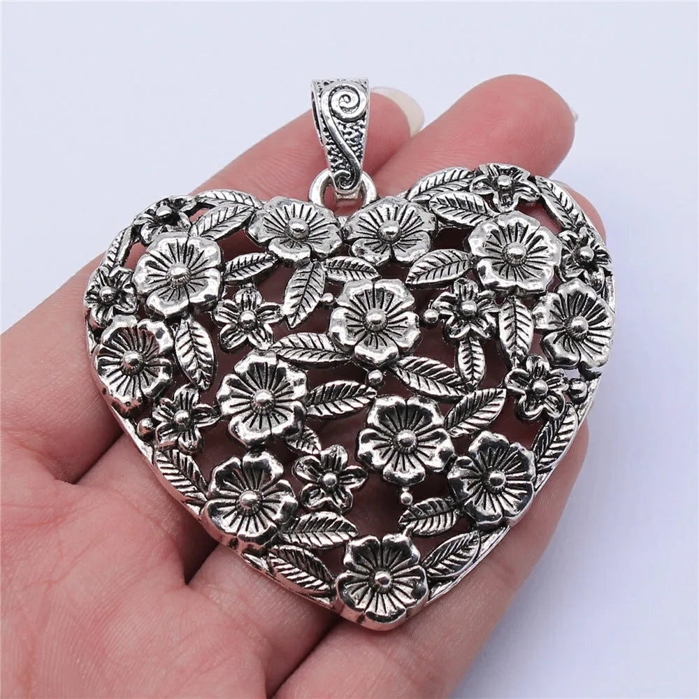 Hollow floral love pendant in ancient silver finish with European American styling