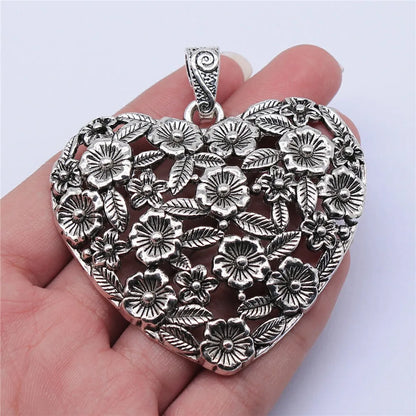 Hollow floral love pendant in ancient silver finish with European American styling