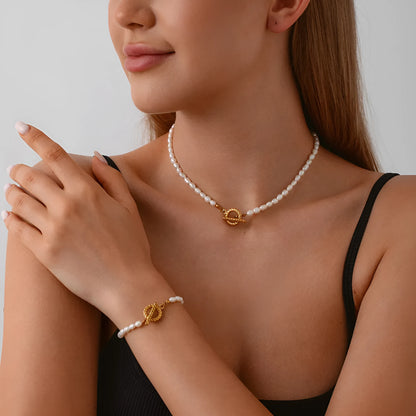 Freshwater pearl and stainless steel geometric pendant necklace with matching bracelet set.