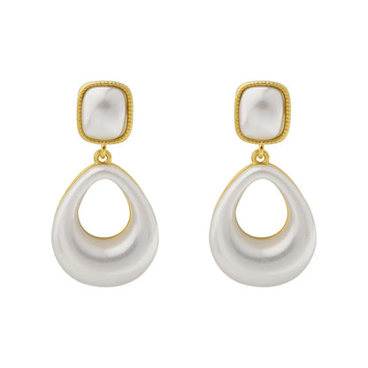 Gold drop earrings with imitation mabe pearl component and 14K gold plating