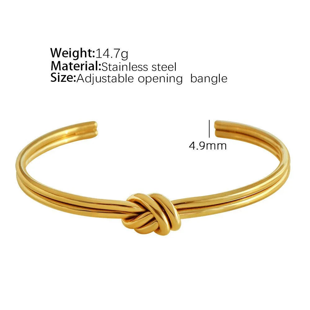 Stainless steel women's bracelet with knotted C-shape open double-layer design in gold or silver.