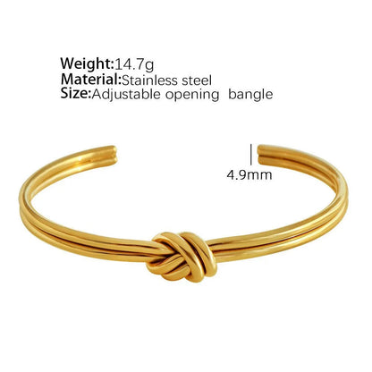 Stainless steel women's bracelet with knotted C-shape open double-layer design in gold or silver.