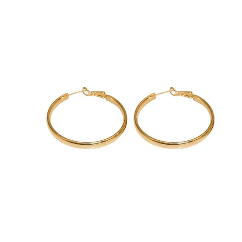 A pair of large, circular metal earrings in gold or silver colour, measuring 40mm.