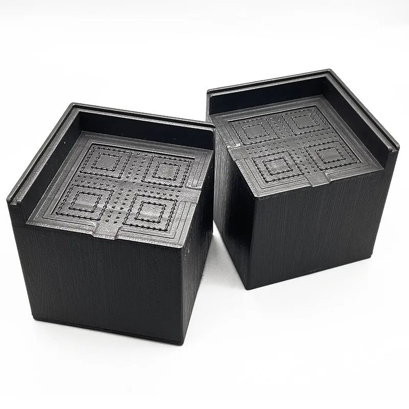 Four black plastic bed foot mats showing 2cm thickness and 10cm diameter for furniture levelling