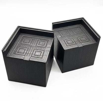 Four black plastic bed foot mats showing 2cm thickness and 10cm diameter for furniture levelling