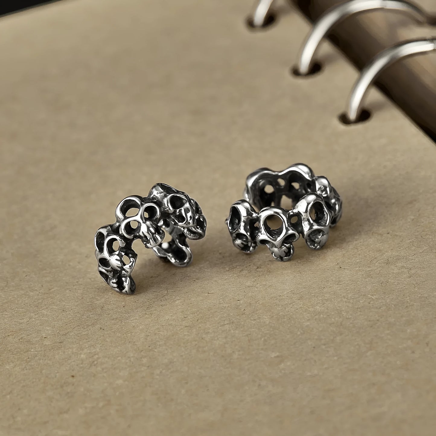 Stainless steel skull ear clip earrings with hollow geometric design and electroplated finish