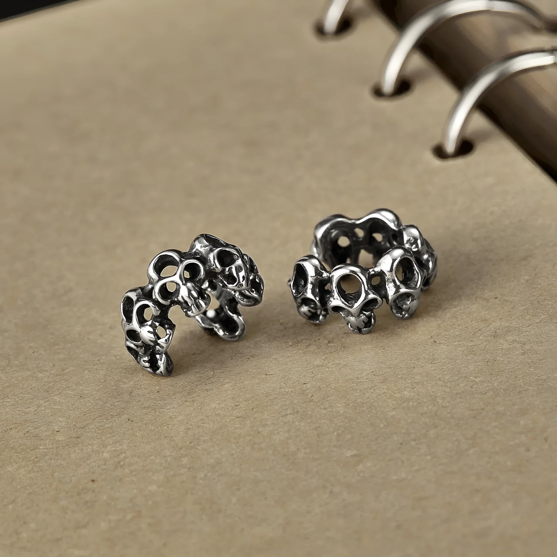 Stainless steel skull ear clip earrings with hollow geometric design and electroplated finish