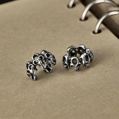 Stainless steel skull ear clip earrings with hollow geometric design and electroplated finish
