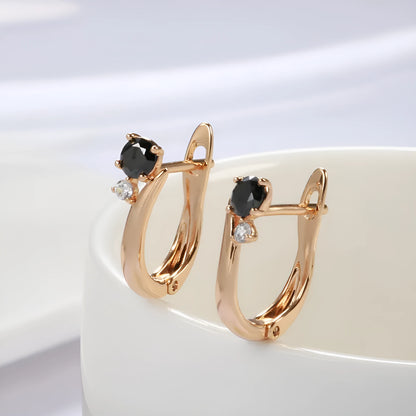 Gold-coloured women's drop earrings with black agate inlay in geometric design