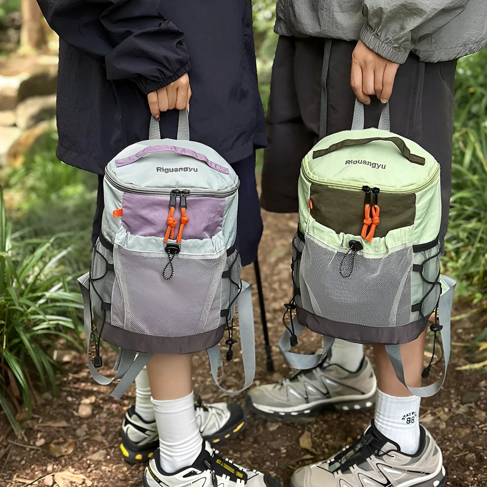 Waterproof nylon casual backpack in blue with curved shoulder straps and fold details