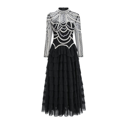 Black long sleeve beaded dress for women with 3D decoration and mid-waist fit.