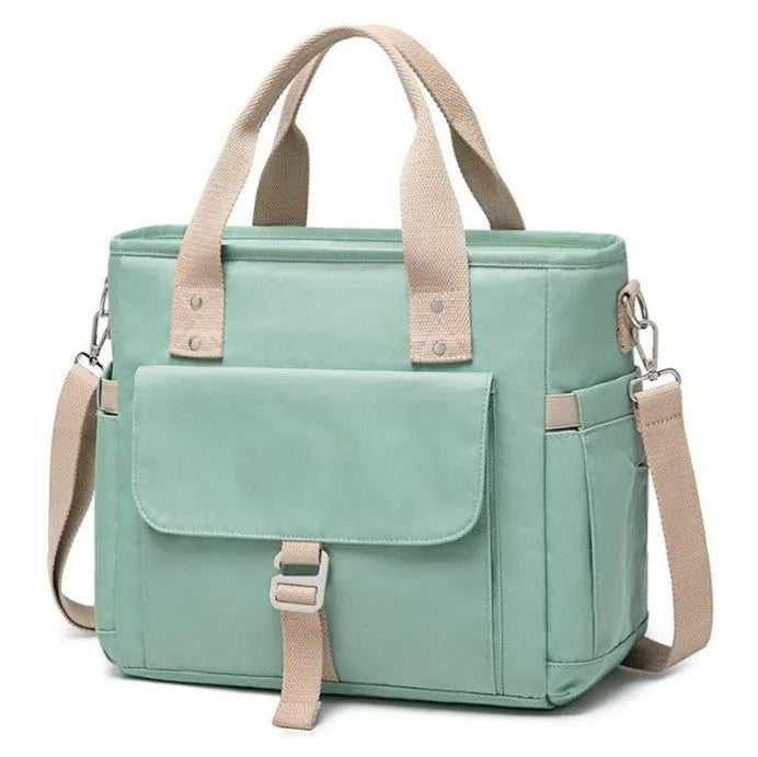 A pink cube-style Oxford cloth belt bag with a removable shoulder strap and a side pocket.